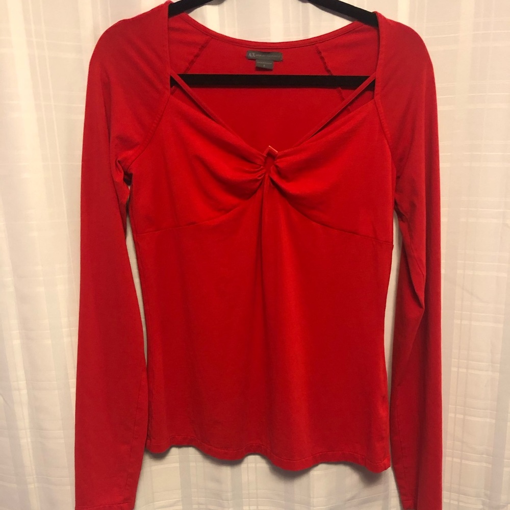 Long sleeve red top.